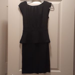 Black sleeveless peplum dress with buttons design